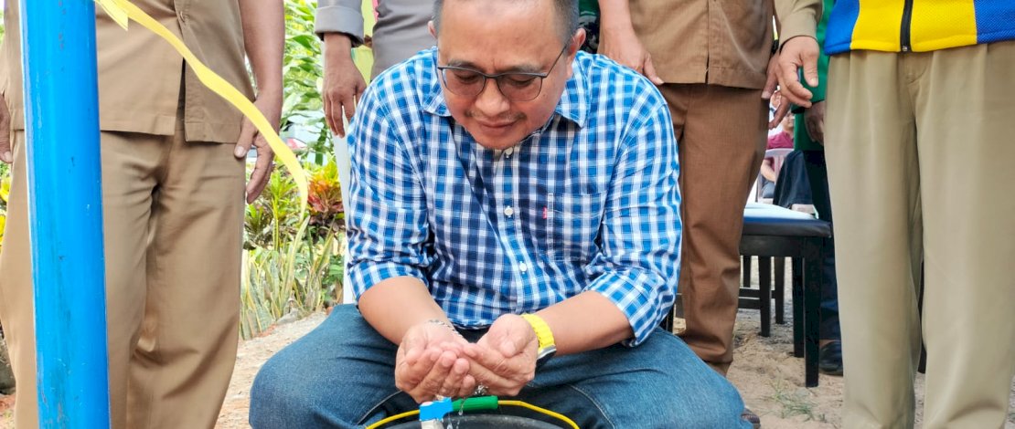 Anggota Komisi V DPR RI, Muhammad Fauzi, meresmikan Infrastruktur Berbasis Masyarakat (IBM) Pamsimas di Desa Minanga Tallu, Kecamatan Sukamaju.