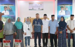 Bupati Basli Ali Serahkan Bantuan Beras untuk 12.209 KK